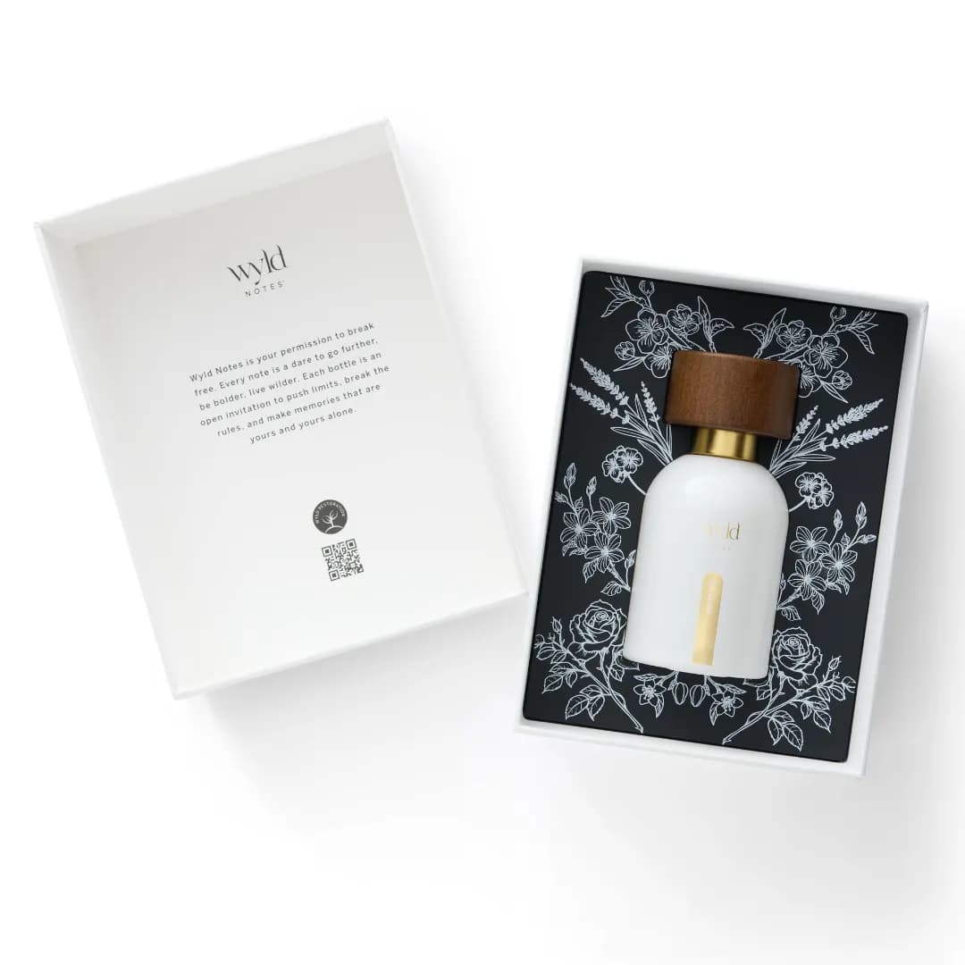 Wyld Notes White Lie next to its opened gift box